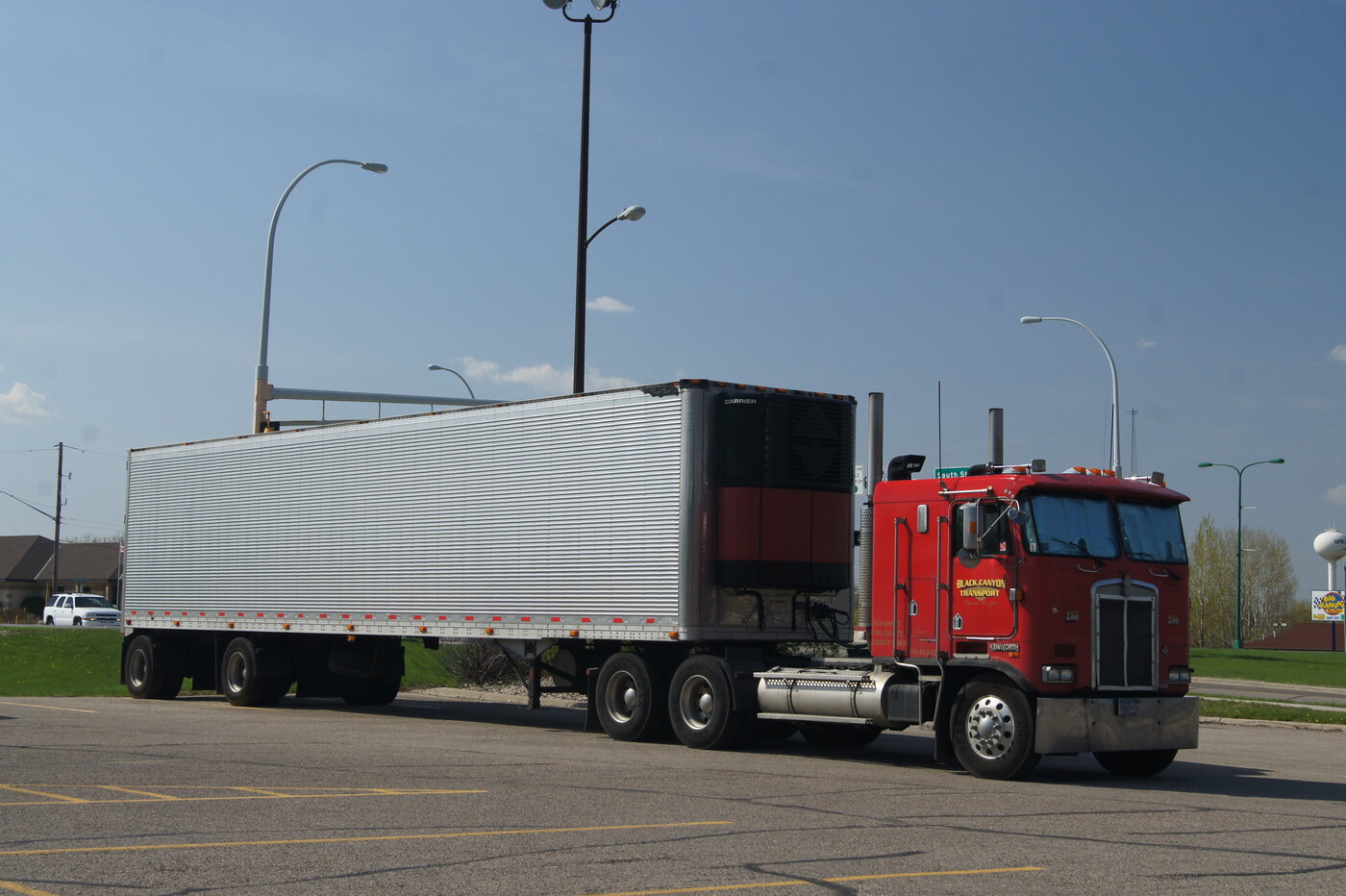 Representative Kenworth semi-truck and trailer