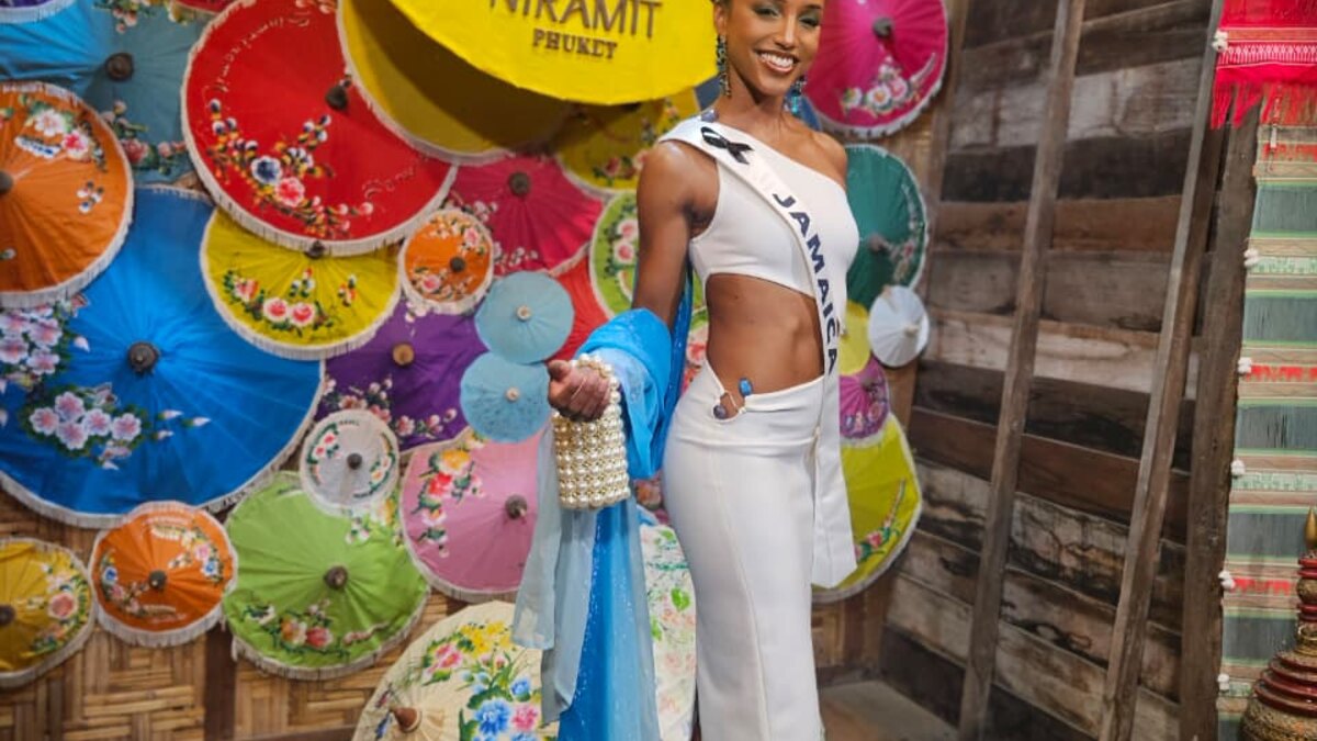 Dr. Gabrielle Henry wearing her Jamaica sash at a Miss Universe event in Thailand in 2025
