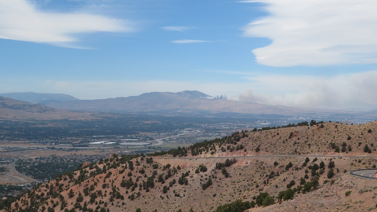 Smoke rising from a wildfire on Peavine Mountain above Reno, Nevada