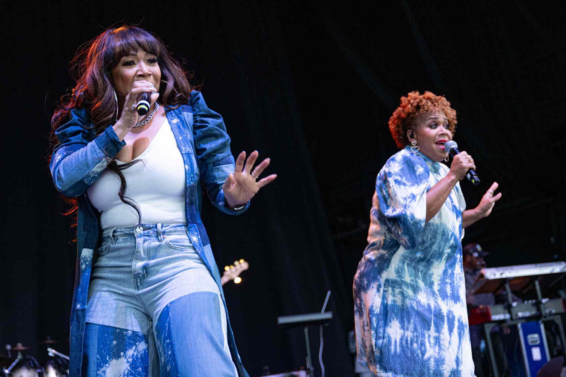 Tina Campbell and Erica Campbell performing together as Mary Mary in 2023