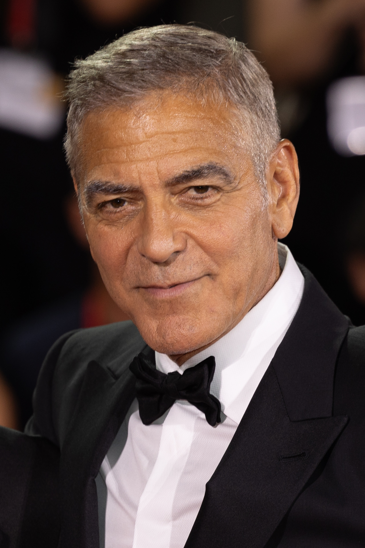George Clooney attending an international film event in a dark suit