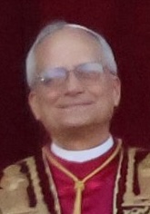 Pope Leo XIV wearing white papal vestments and speaking outdoors