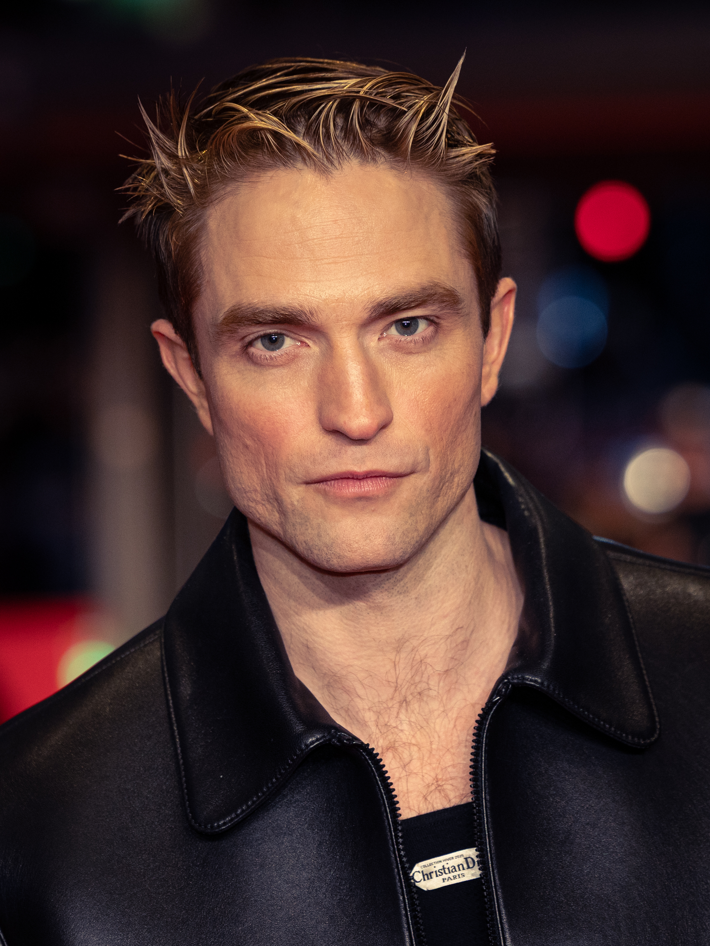 Actor Robert Pattinson posing at a film festival photo call
