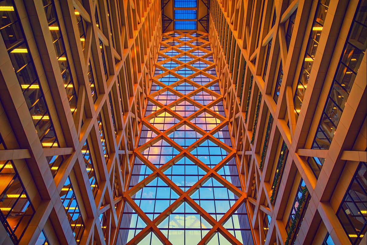 File photograph looking upward through the orange structural framework of the Hennepin County Government Center atrium in Minneapolis.