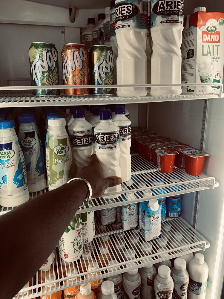 Refrigerated dairy products displayed in a supermarket