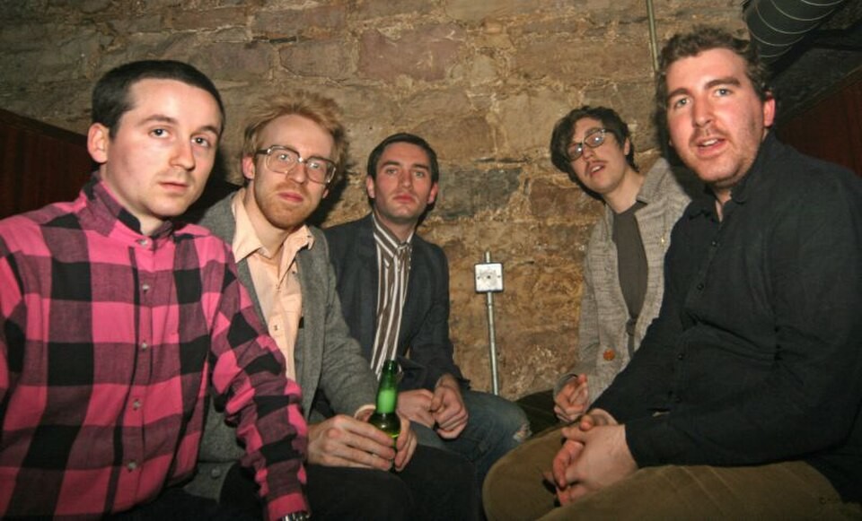 Hot Chip seated together at Cabaret Voltaire in May 2006