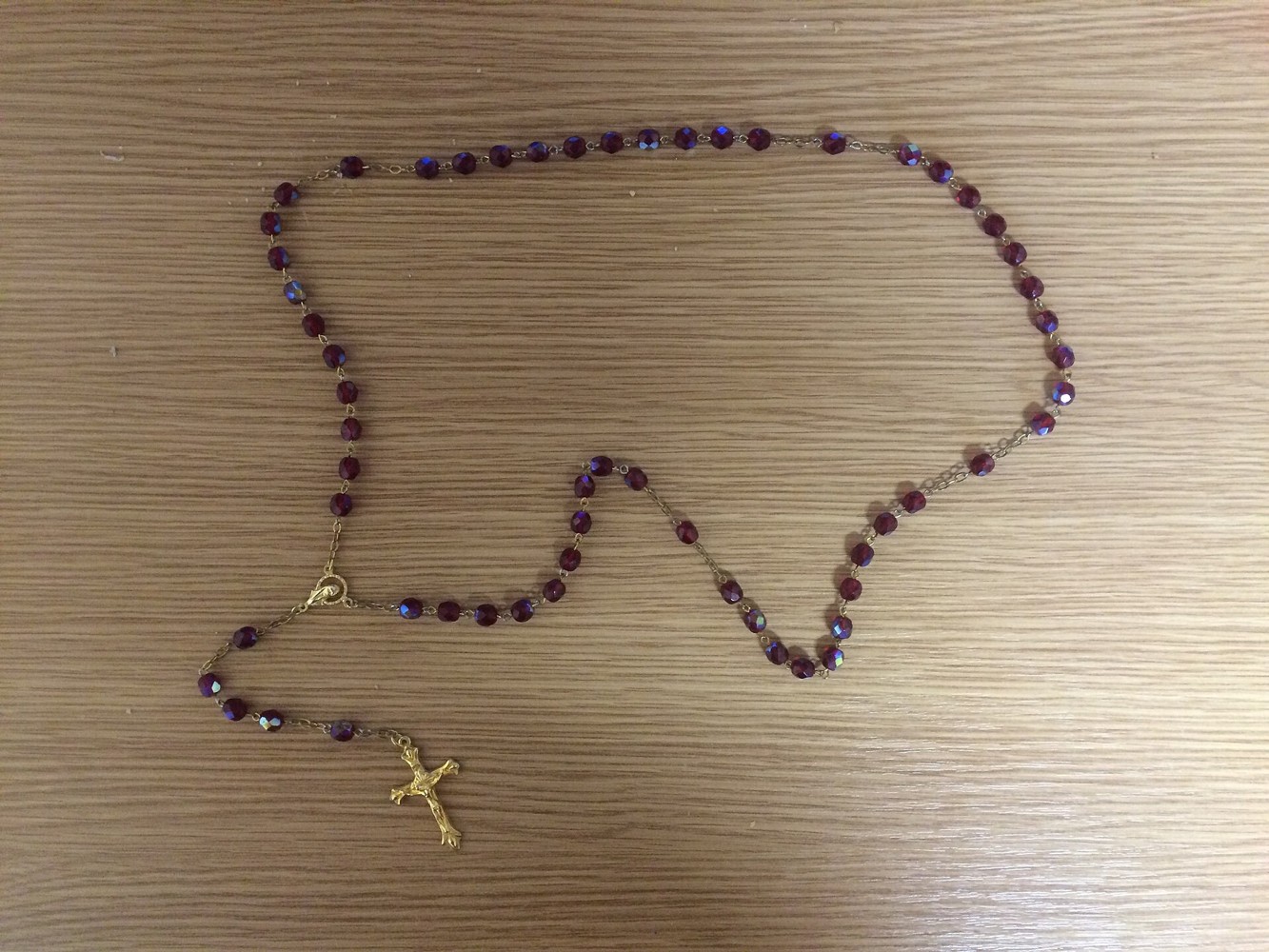 A rosary with beads and a crucifix