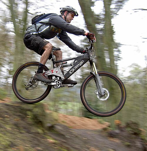 Mountain biker Lee Collis jumping at Rothbury, Northumberland