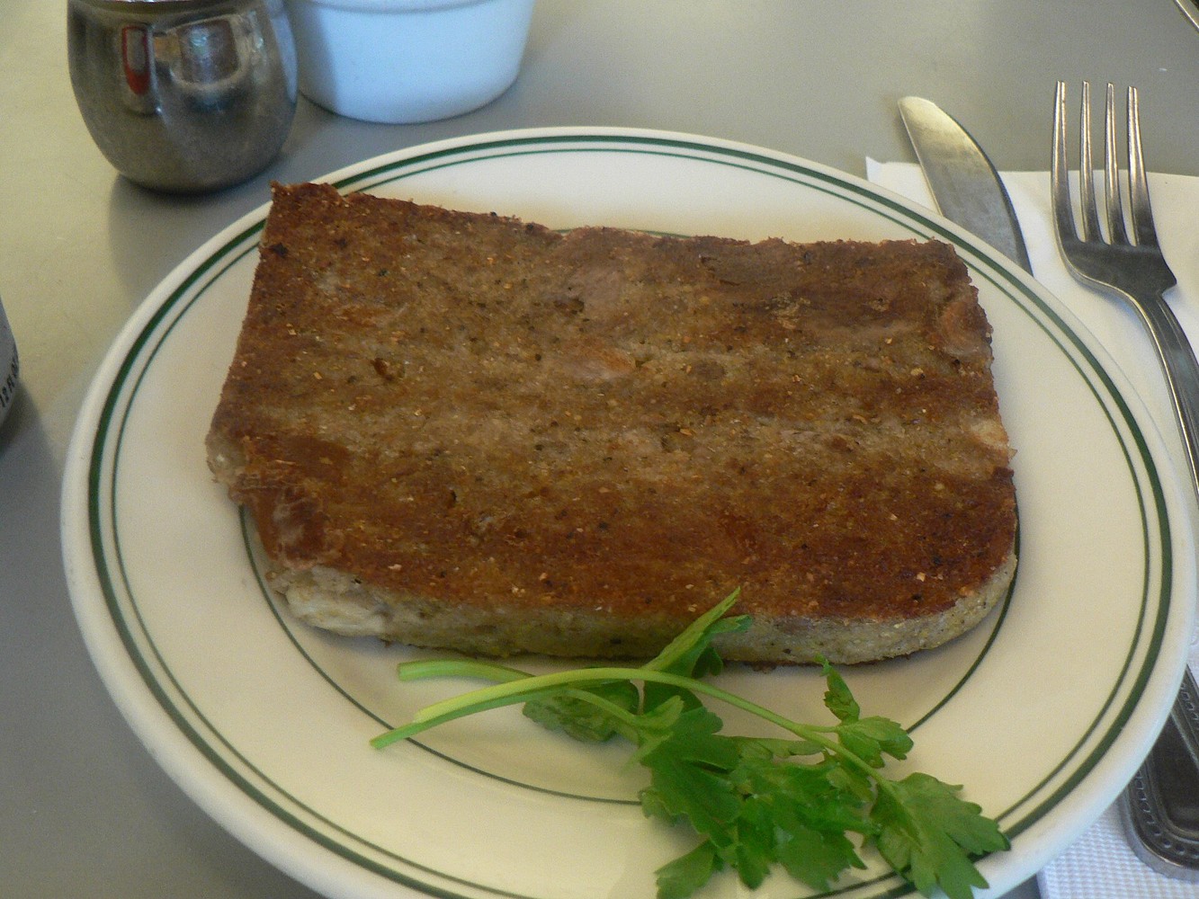 Cooked slices of scrapple on a plate