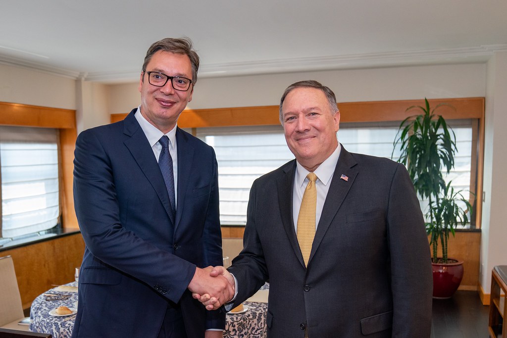 Aleksandar Vučić at left shaking hands with Mike Pompeo in New York in August 2019