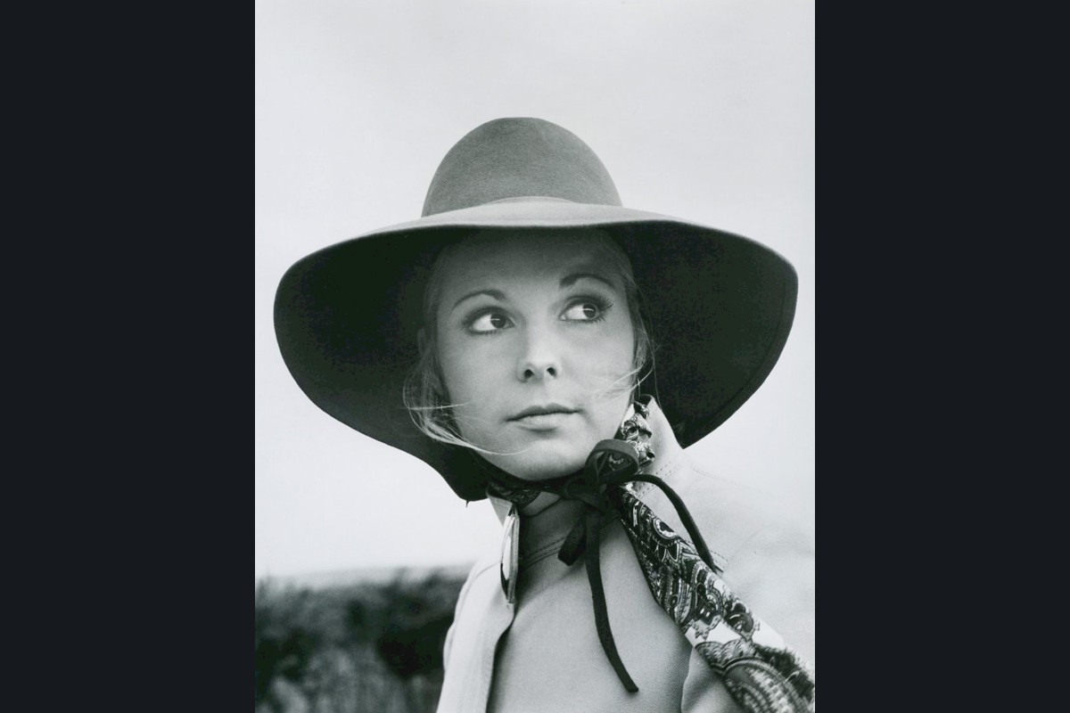 Black-and-white 1969 publicity photograph of Susan Saint James wearing a broad-brimmed hat and patterned scarf.