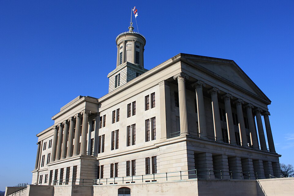 The Tennessee State Capitol’s stone facade, columns and tower beneath a clear blue sky in March 2009.