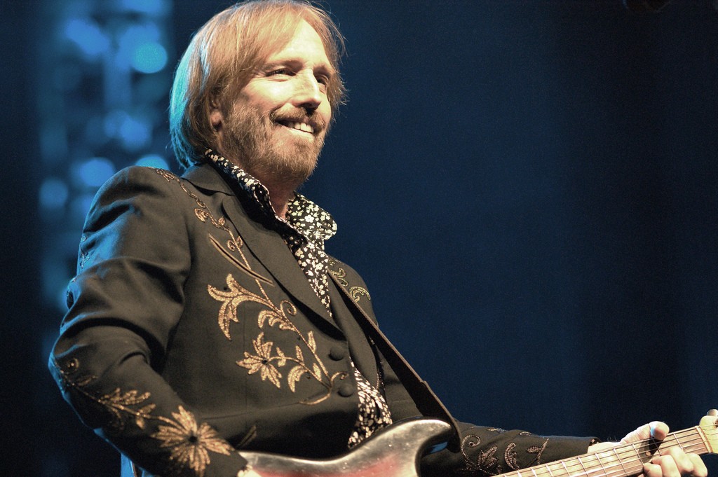 Tom Petty performing with a guitar in a June 2010 concert photograph