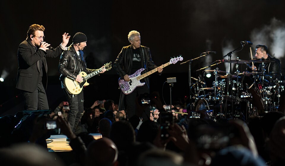 U2 performing together on a small concert stage in Seattle in 2017