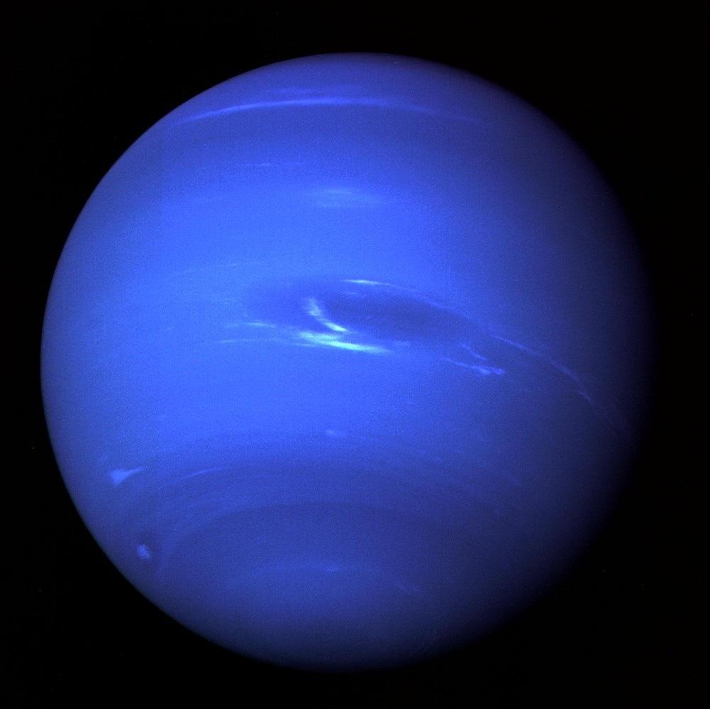 A processed Voyager 2 camera view of Neptune showing clouds and the Great Dark Spot